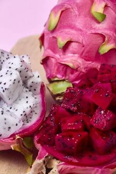Red dragon fruit Set with appetizing serving on pink background. Top view Stock Photos