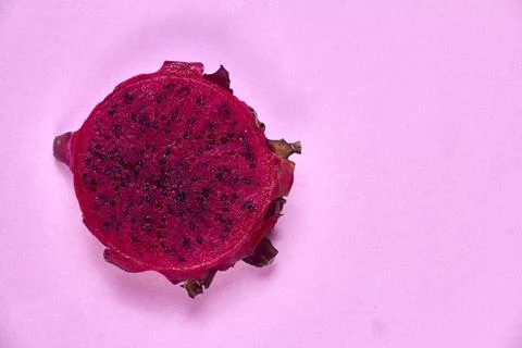 Red dragon fruit Set with appetizing serving on pink background. Top view Stock Photos