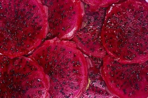 Red dragon fruit Set with appetizing serving on green background. Top view Stock Photos