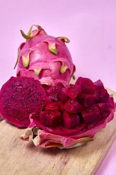 Red dragon fruit Set with appetizing serving on pink background. Top view Stock Photos