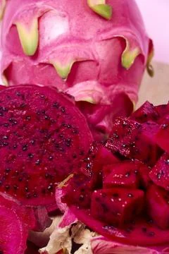 Red dragon fruit Set with appetizing serving on pink background. Top view Stock Photos