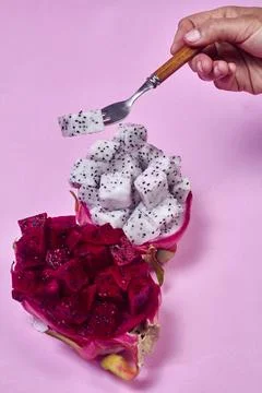 Red dragon fruit Set with appetizing serving on pink background. Top view Stock Photos