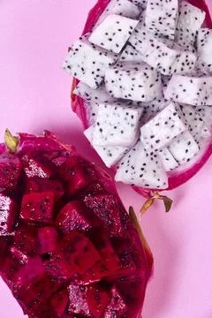 Red dragon fruit Set with appetizing serving on pink background. Top view Stock Photos