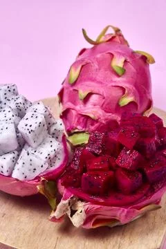 Red dragon fruit Set with appetizing serving on pink background. Top view Stock Photos