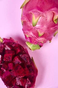 Red dragon fruit Set with appetizing serving on pink background. Top view Stock Photos