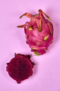 Red dragon fruit Set with appetizing serving on pink background. Top view Stock Photos
