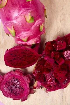 Red dragon fruit Set with appetizing serving on pink background. Top view Stock Photos