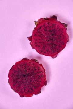 Red dragon fruit Set with appetizing serving on pink background. Top view Stock Photos