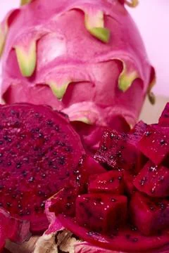 Red dragon fruit Set with appetizing serving on pink background. Top view Stock Photos