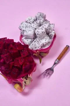 Red dragon fruit Set with appetizing serving on pink background. Top view Stock Photos