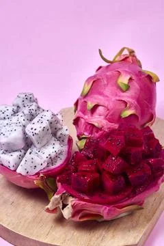 Red dragon fruit Set with appetizing serving on pink background. Top view Stock Photos