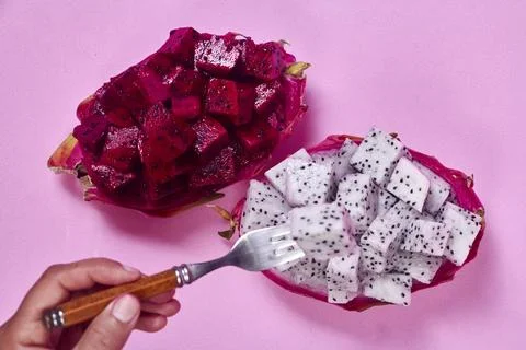 Red dragon fruit Set with appetizing serving on pink background. Top view Stock Photos