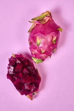 Red dragon fruit Set with appetizing serving on pink background. Top view Stock Photos