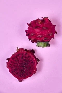 Red dragon fruit Set with appetizing serving on pink background. Top view Stock Photos