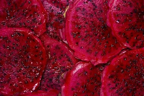 Red dragon fruit Set with appetizing serving on green background. Top view Stock Photos