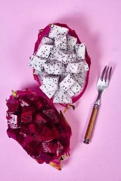 Red dragon fruit Set with appetizing serving on pink background. Top view Stock Photos