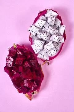 Red dragon fruit Set with appetizing serving on pink background. Top view Stock Photos