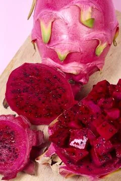 Red dragon fruit Set with appetizing serving on pink background. Top view Stock Photos
