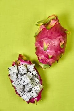 Red dragon fruit Set with appetizing serving on green background. Top view Stock Photos