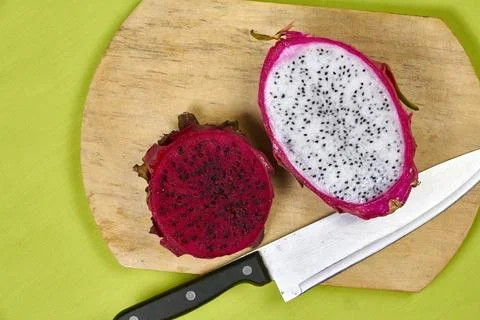 Red dragon fruit Set with appetizing serving on green background. Top view Stock Photos