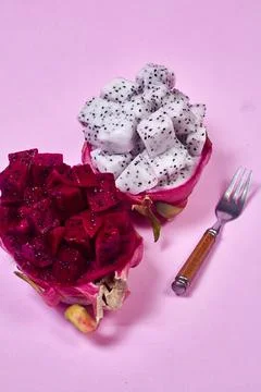 Red dragon fruit Set with appetizing serving on pink background. Top view Stock Photos