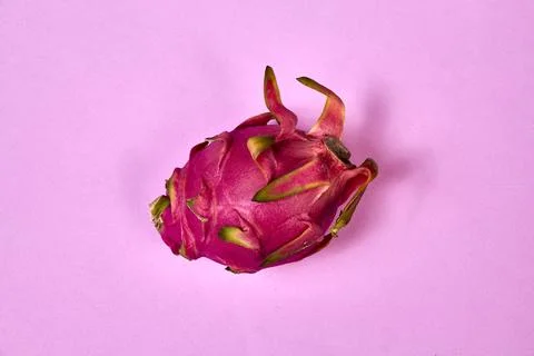 Red dragon fruit Set with appetizing serving on pink background. Top view Stock Photos
