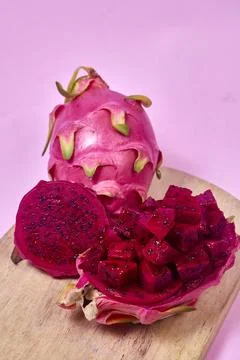 Red dragon fruit Set with appetizing serving on pink background. Top view Stock Photos