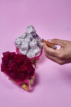 Red dragon fruit Set with appetizing serving on pink background. Top view Stock Photos