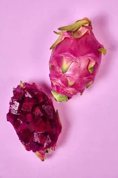 Red dragon fruit Set with appetizing serving on pink background. Top view Stock Photos