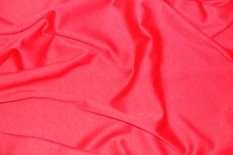 Red draped material, texture for red background Stock Photos