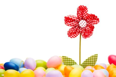 Red drapery flower between easter eggs Stock Photos
