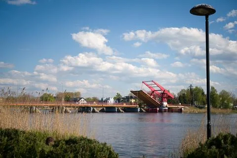 Red drawbridge opened over the river in Dziwnow Poland Photos