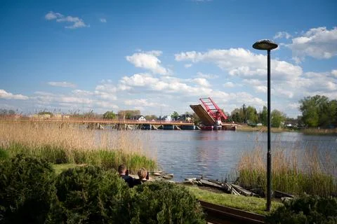 Red drawbridge opened over the river in Dziwnow Poland Stock Photos