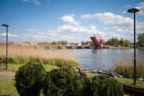 Red drawbridge opened over the river in Dziwnow Poland Stock Photos