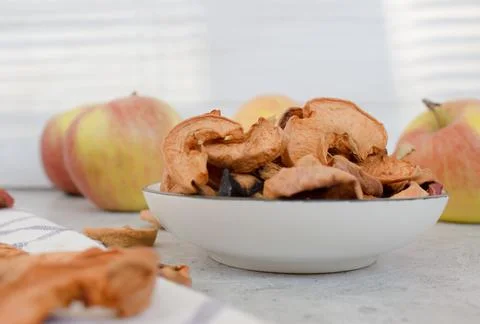 Red dried apples on the gray table close up Stock Photos