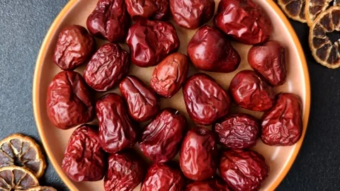 Red dried dates, the Chinese sweet fruit jujube, as a healthy food. Red dates, j Stock Footage 326732672
