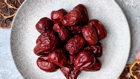 Red dried dates, the Chinese sweet fruit jujube, as a healthy food. Red dates, j Stock Footage 326732832
