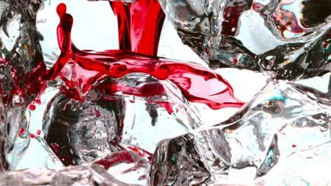 The red drink flows on the ice Stock Photos