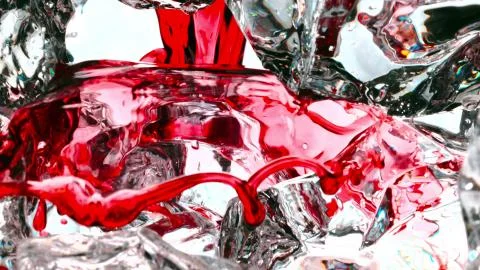 The red drink flows on the ice Stock Photos