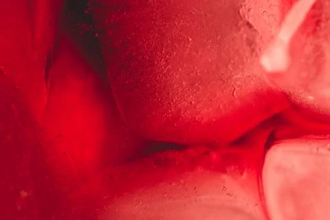Red drink with ice cubes Stock Photos