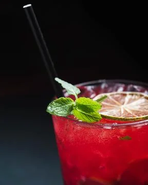 Red drink with mint and lime Фото