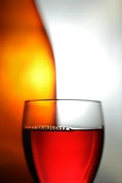 Red drink with orange bottle Stock Photos