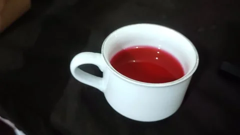 Red drink stirrer in cup Stock Footage 287692913