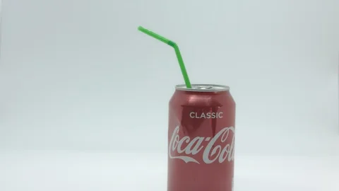 Red drinks can with plastic straw pull focus Stock Footage 85854863