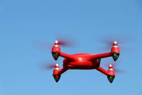 Red drone on a blue sky background Stock Photos