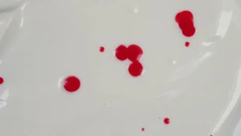 Red drops fall on a light base Stock Footage 235817836