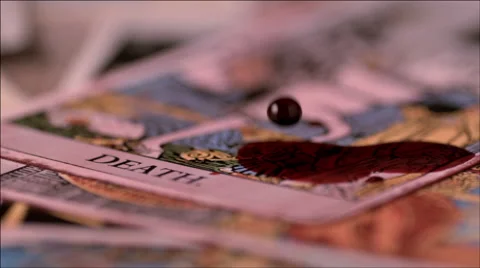 Red drops falling on death tarot card Видео 46667968