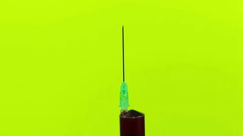 Red drops from the tip of a syringe needle Stock-Footage 71452743
