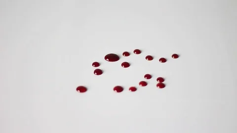Red drops on a white table Stock Footage 71951813