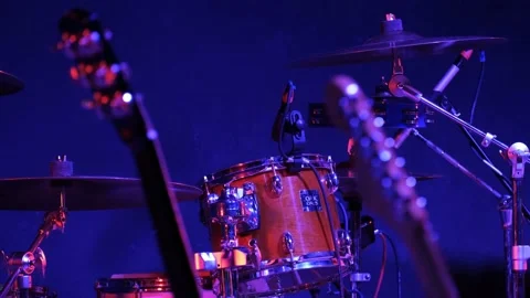 Red drums and 2 guitars are on an empty stage before a concert Video stock 155200540